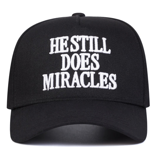 HE STILL DOES MIRACLES Trucker Hat
